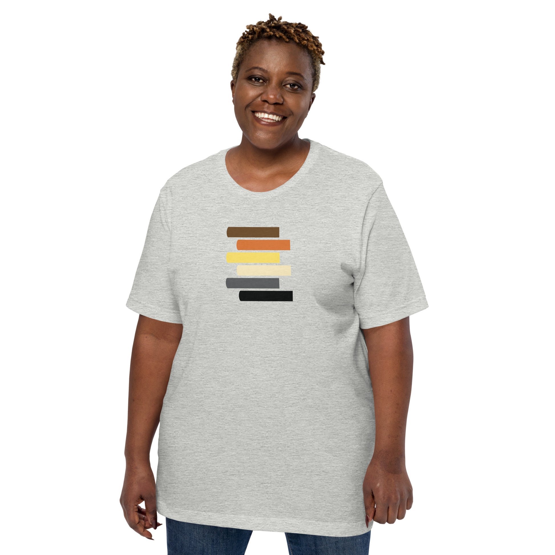 A gray t-shirt with a graphic design featuring horizontal lines in various shades of brown, black, white, and yellow on the front.