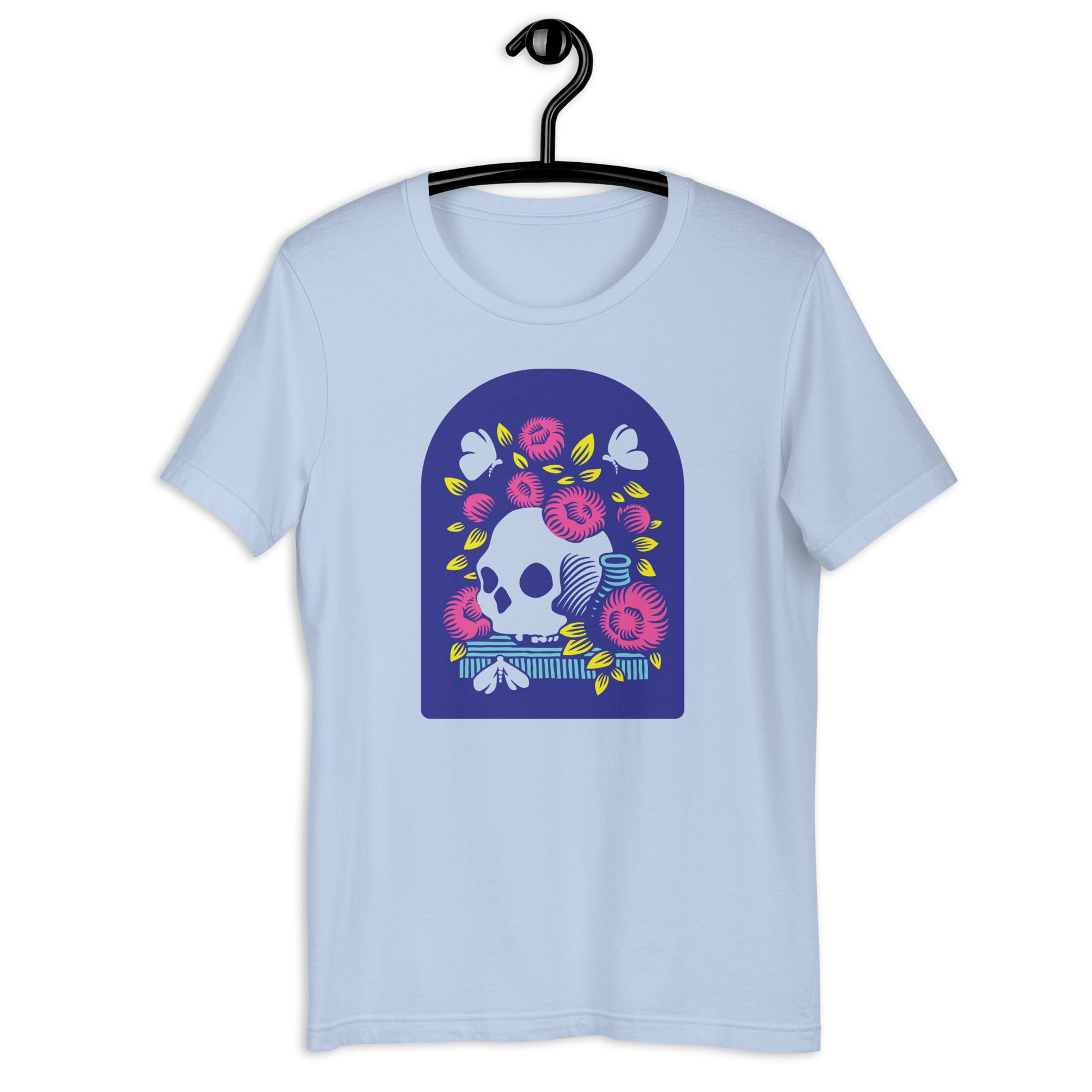 A light blue crew neck t-shirt with a graphic print of a skull surrounded by flowers, inspired by a Vanitas still life painting.