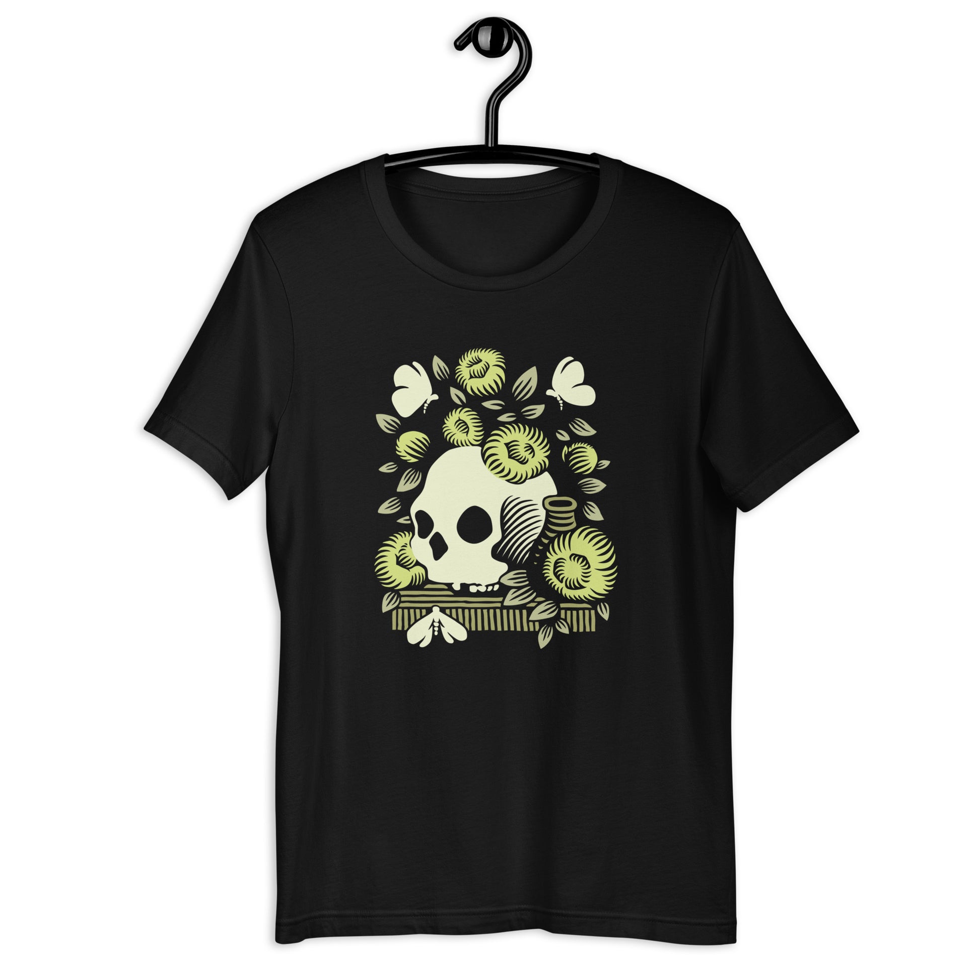 Black t-shirt with a graphic of a skull surrounded by green floral elements on the front inspired by Vanitas still life painting.