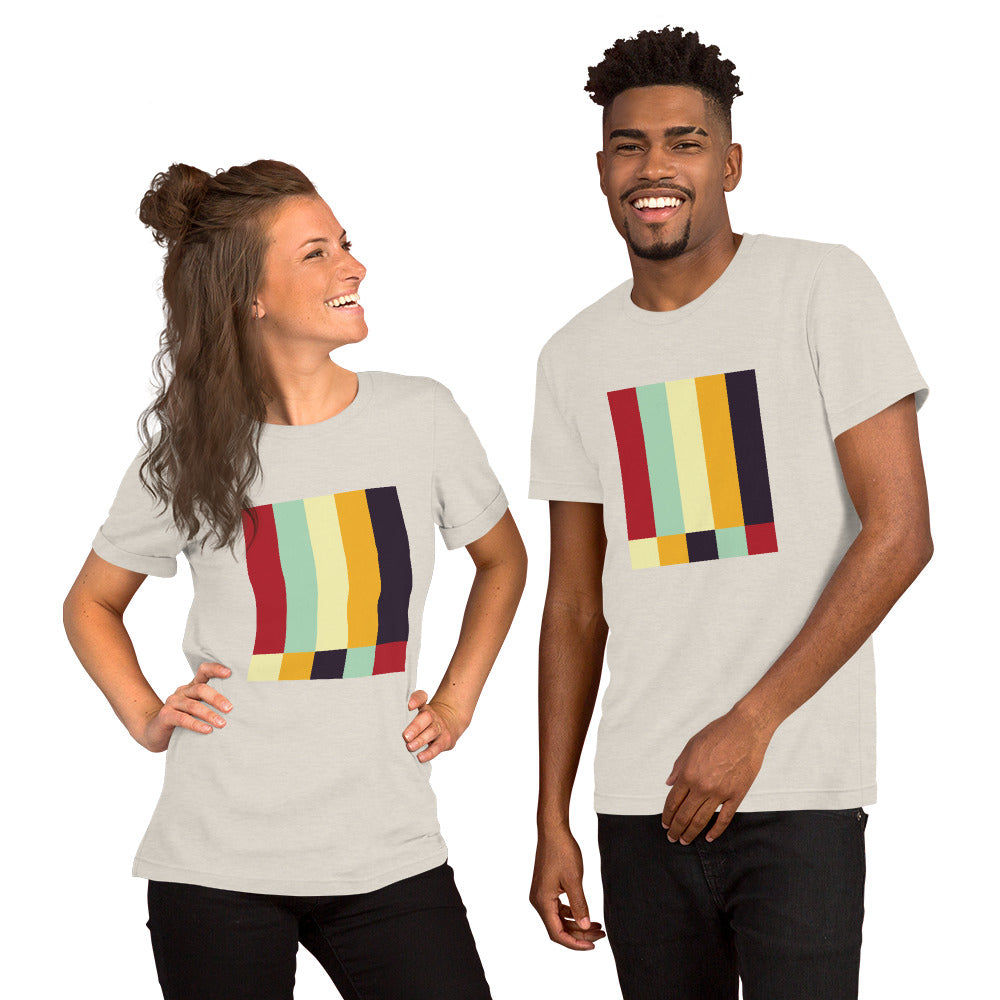 A man and a woman showcasing a heather-dust colored t-shirt featuring a bold geometric color-block pattern in solid colors.