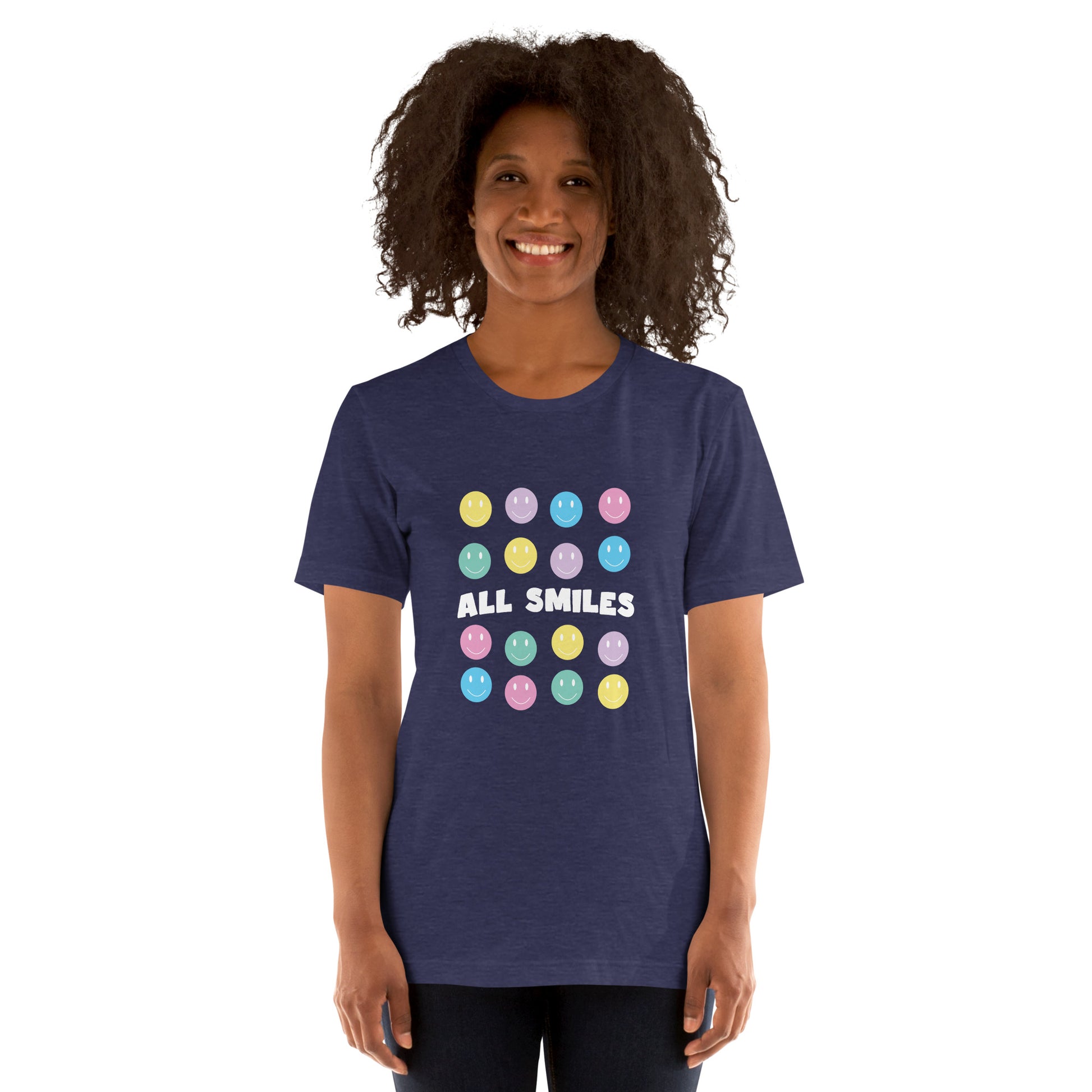 Woman wearing a navy T-shirt with "ALL SMILES" text written on it along with smiley faces surrounding the text.