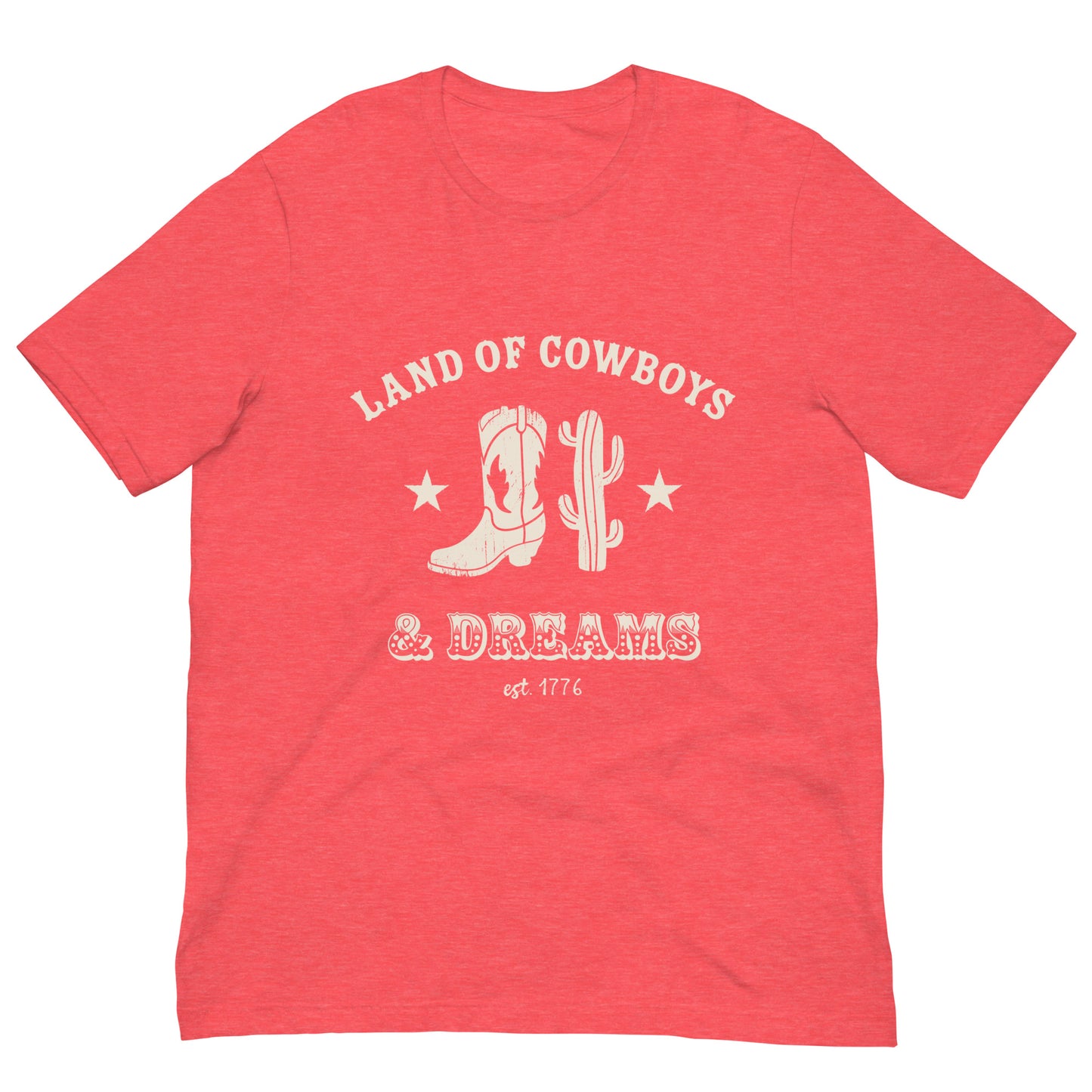 Red t-shirt with a white graphic featuring a cowboy boot, cactus, and text that says “Land of the Cowboys and Dreams est. 1776.”