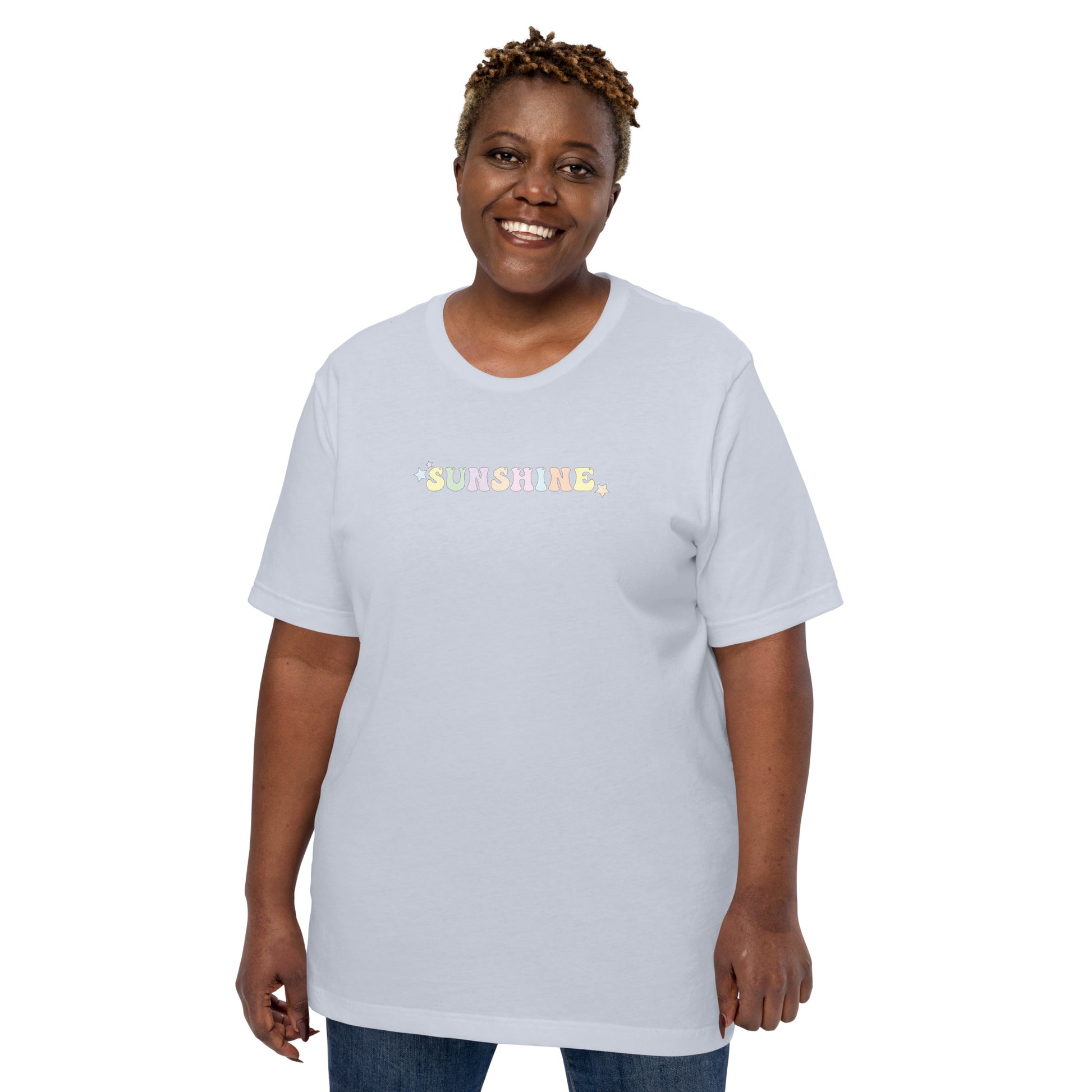A woman wearing a light blue t-shirt with the word "Sunshine" and colorful stars on the front.