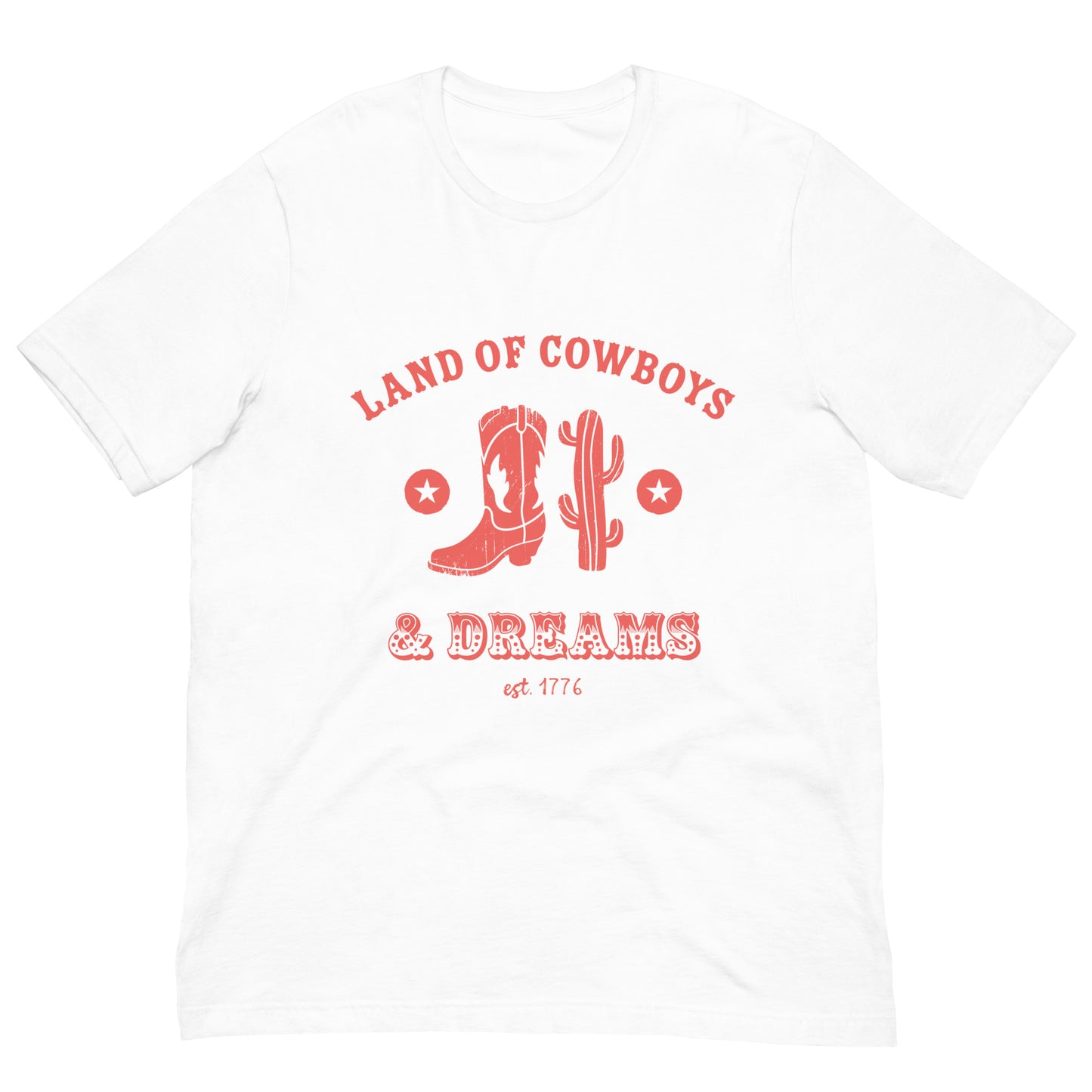 White t-shirt with a red graphic featuring a cowboy boot, cactus, and text that says “Land of the Cowboys and Dreams est. 1776.”